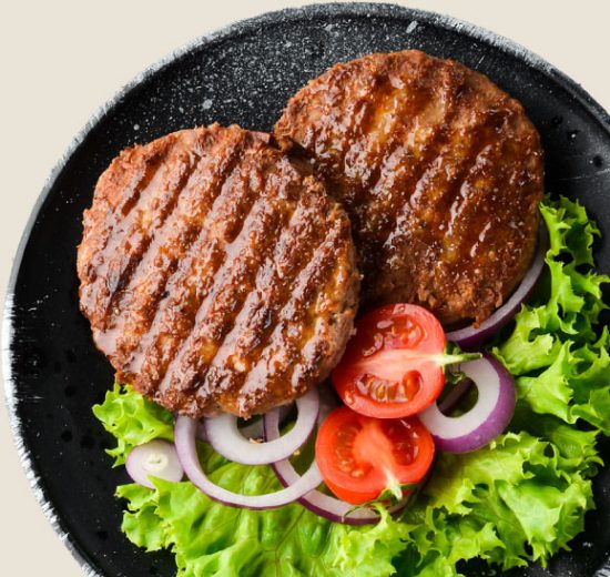 Decorative image of a plate of food featuring meat as the main element.